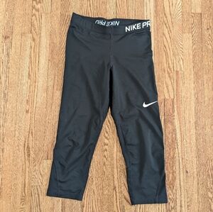 Women's Nike Black Cropped Performance Leggings with White Swoosh